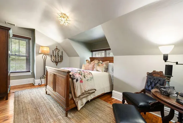 a bedroom with bed and a window