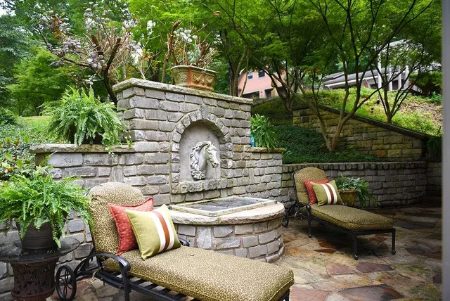 a view of a house with backyard and sitting area