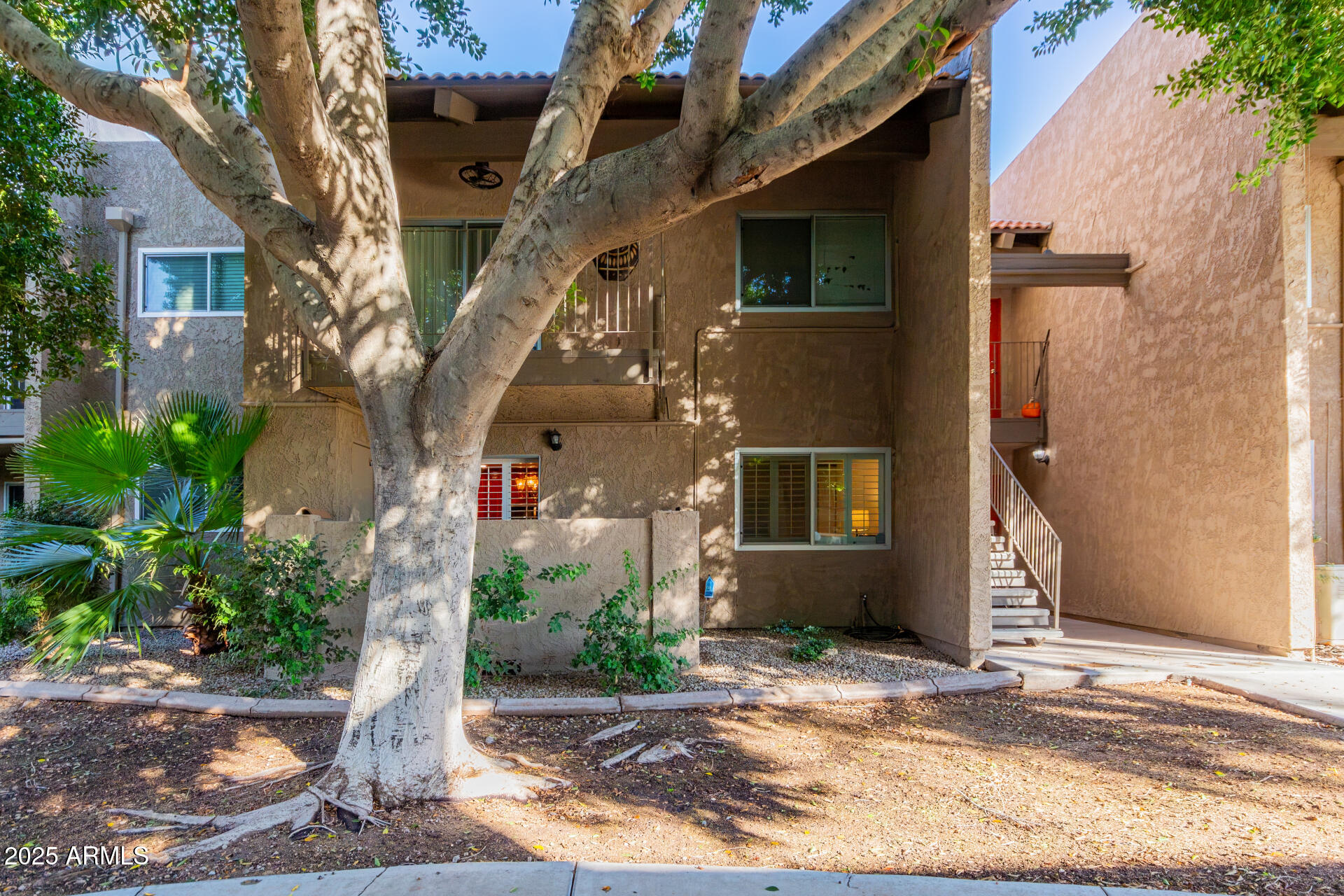5525 East Thomas Road, Unit E3 Phoenix, AZ 85018 - Photo 1 of 34 a front view of a house with a yard