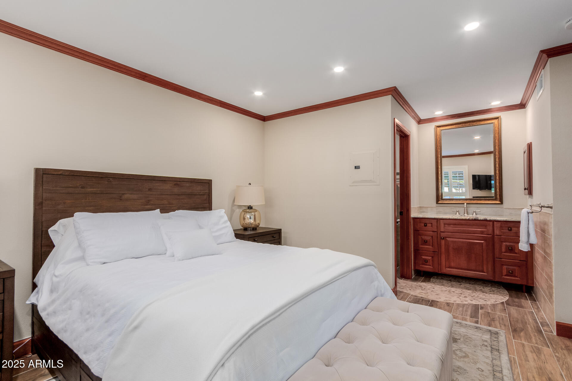 5525 East Thomas Road, Unit E3 Phoenix, AZ 85018 - Photo 16 of 34 a bedroom with a large bed and a dresser