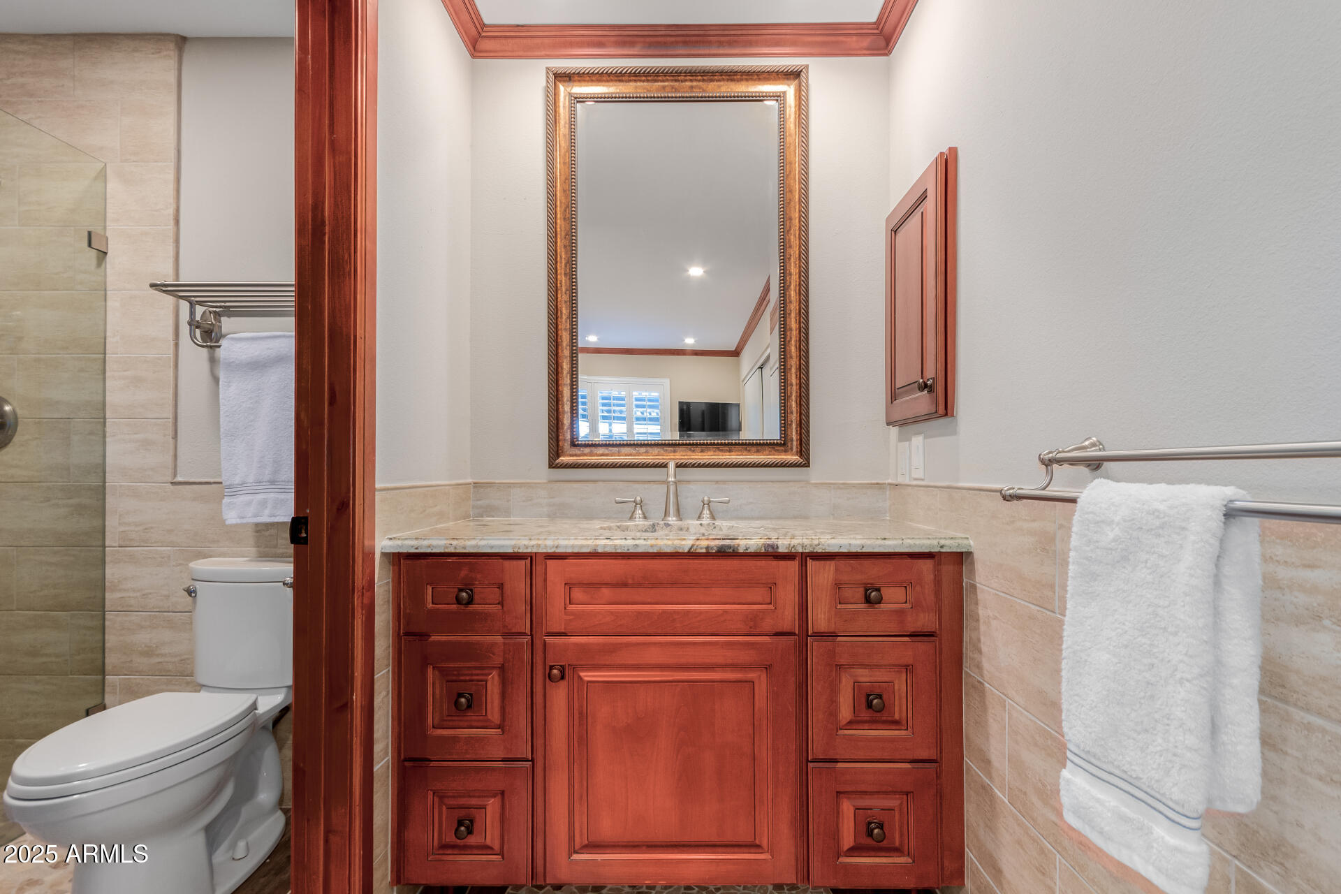 5525 East Thomas Road, Unit E3 Phoenix, AZ 85018 - Photo 19 of 34 a bathroom with a toilet a sink and mirror