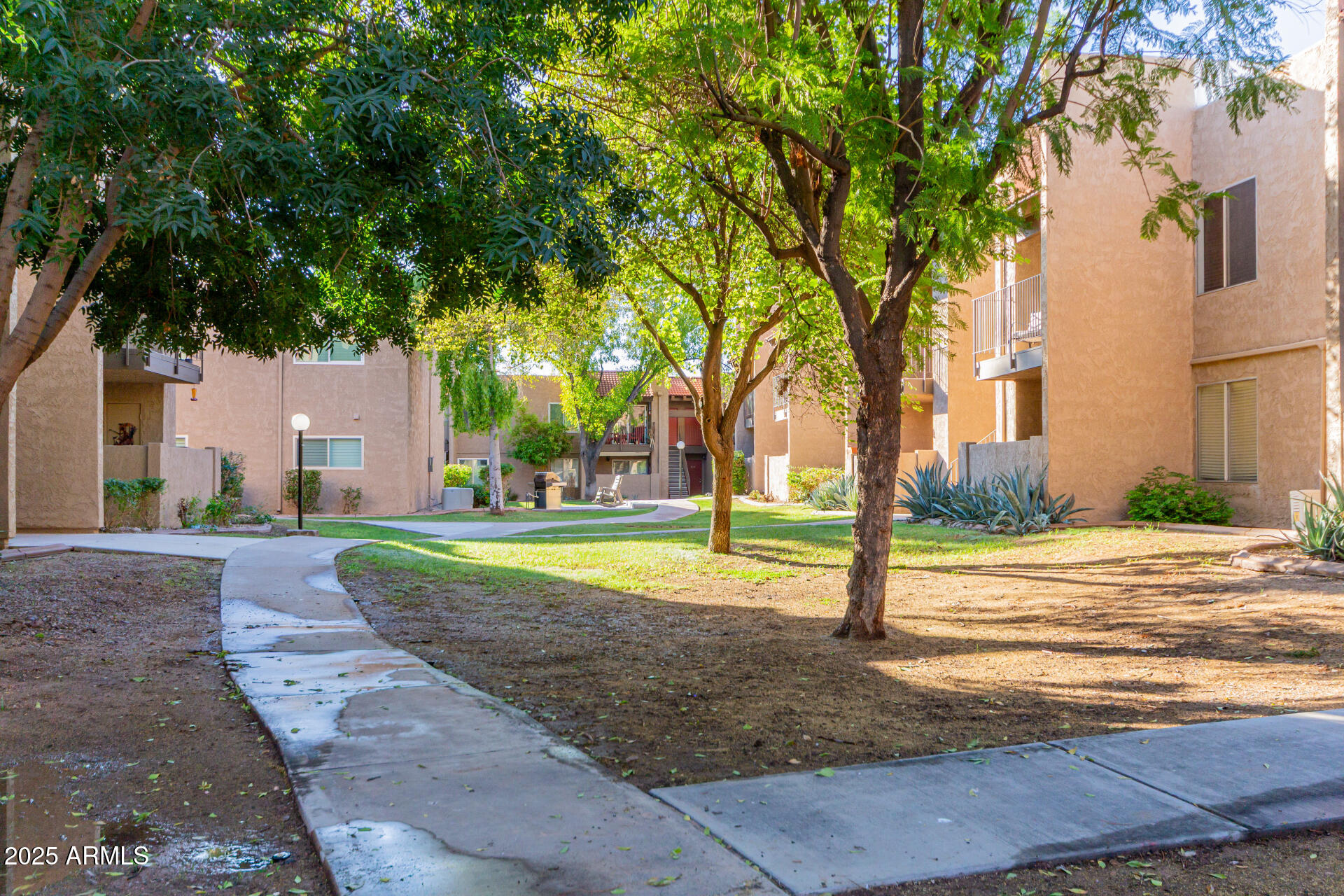 5525 East Thomas Road, Unit E3 Phoenix, AZ 85018 - Photo 31 of 34 a view of a house with backyard and trees