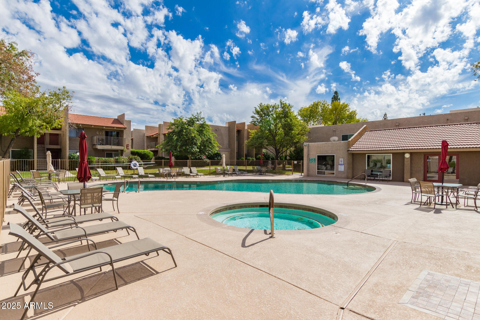 5525 East Thomas Road, Unit E3 Phoenix, AZ 85018 - Photo 32 of 34 a swimming pool with outdoor seating and yard