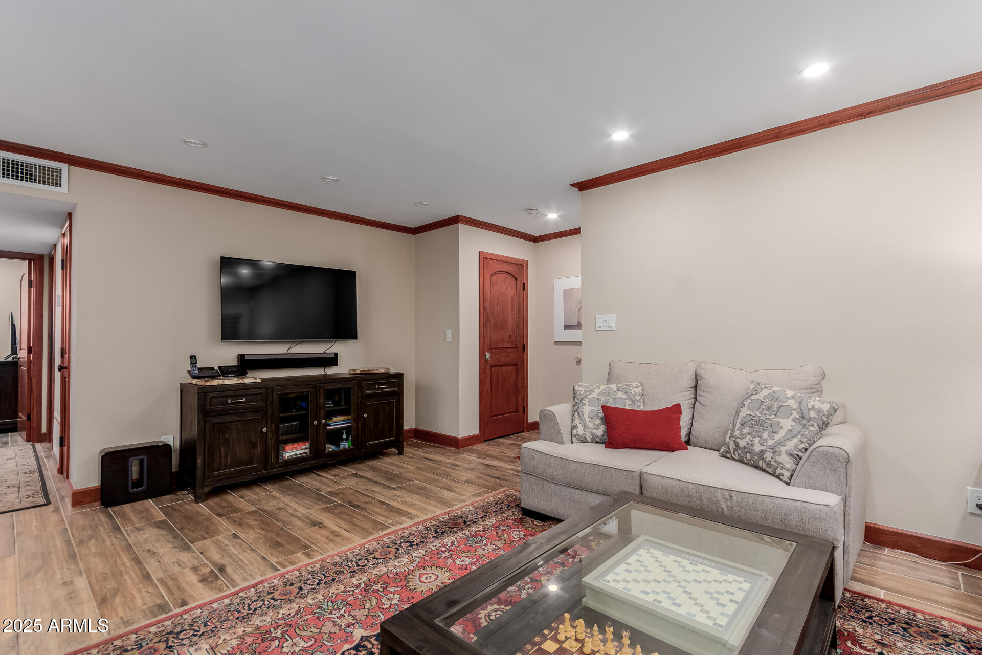 5525 East Thomas Road, Unit E3 Phoenix, AZ 85018 - Photo 5 of 34 a living room with furniture and a flat screen tv