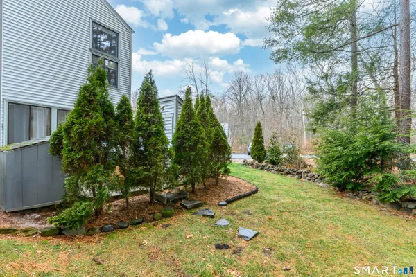 a view of a backyard with potted plants
