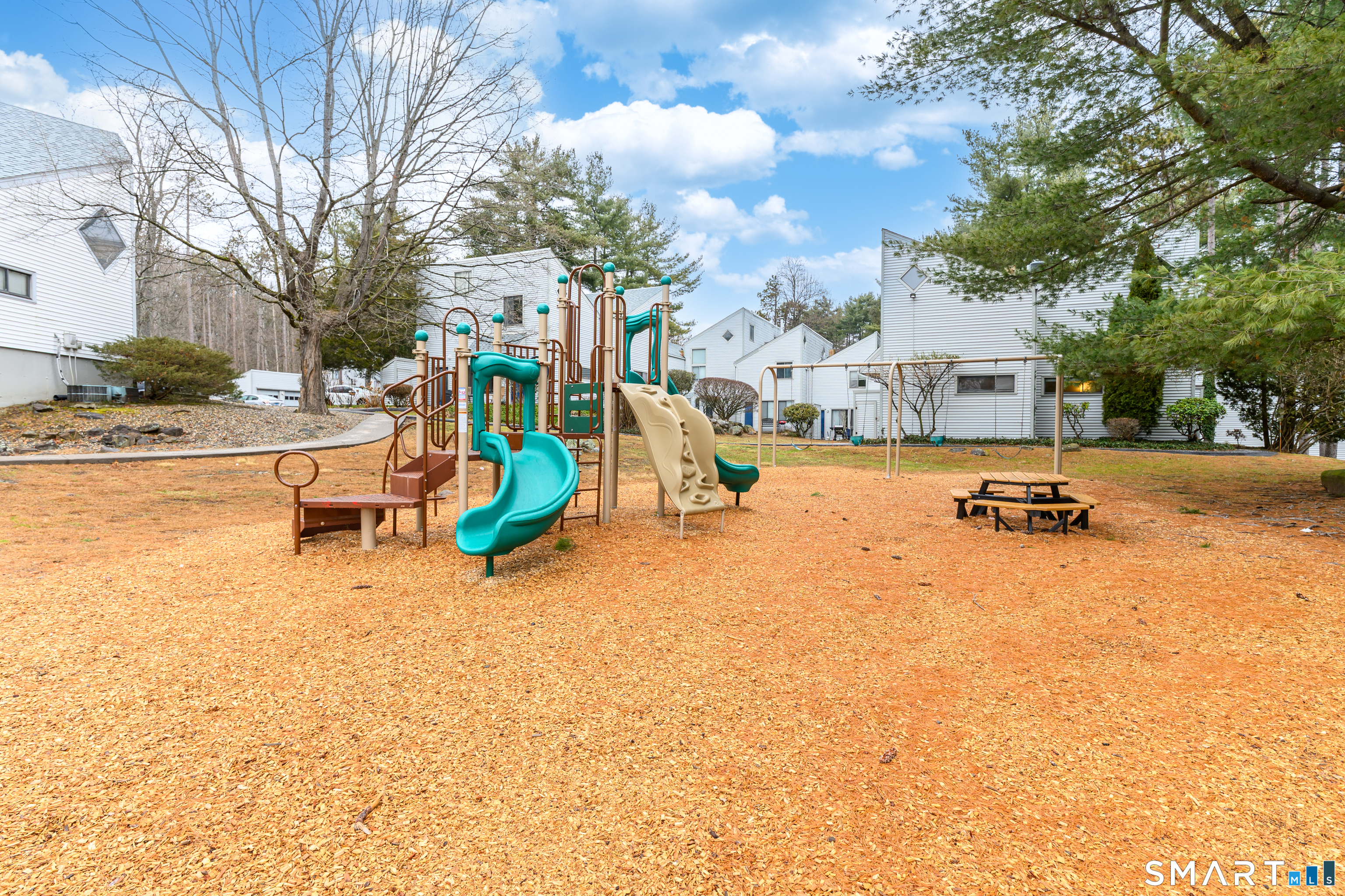 5 Talcott Forest Road, Unit A Farmington, CT 06032 - Photo 29 of 36 a view of a park with swings and slides