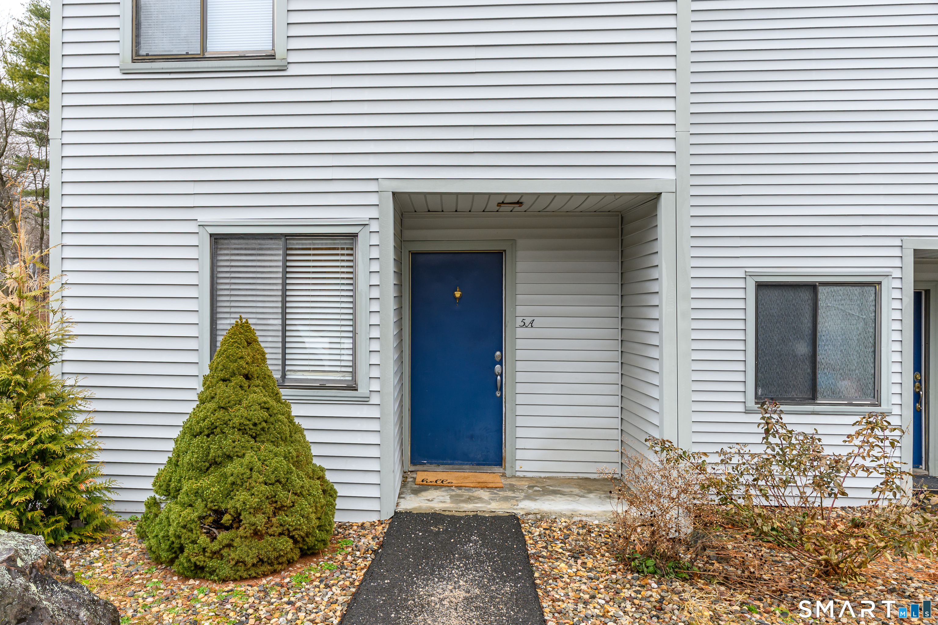 5 Talcott Forest Road, Unit A Farmington, CT 06032 - Photo 3 of 36 a view of a house with a yard and garage
