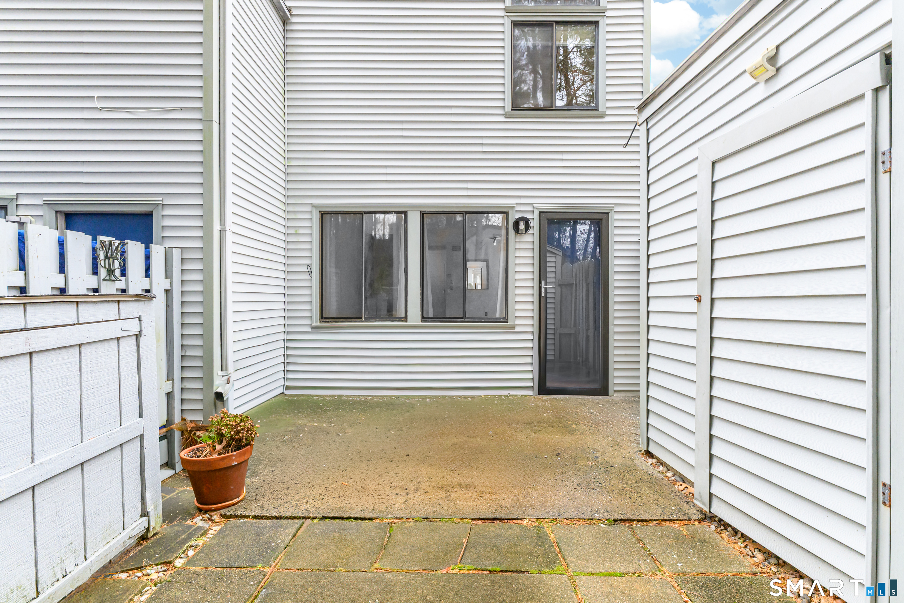 5 Talcott Forest Road, Unit A Farmington, CT 06032 - Photo 10 of 36 a view of a patio with chair and potted plants