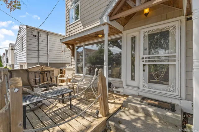 a view of a chair and table in the patio
