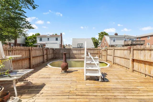 a view of a swimming pool with seating area
