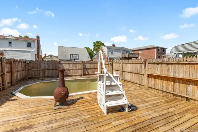 a view of a house with swimming pool and sitting area