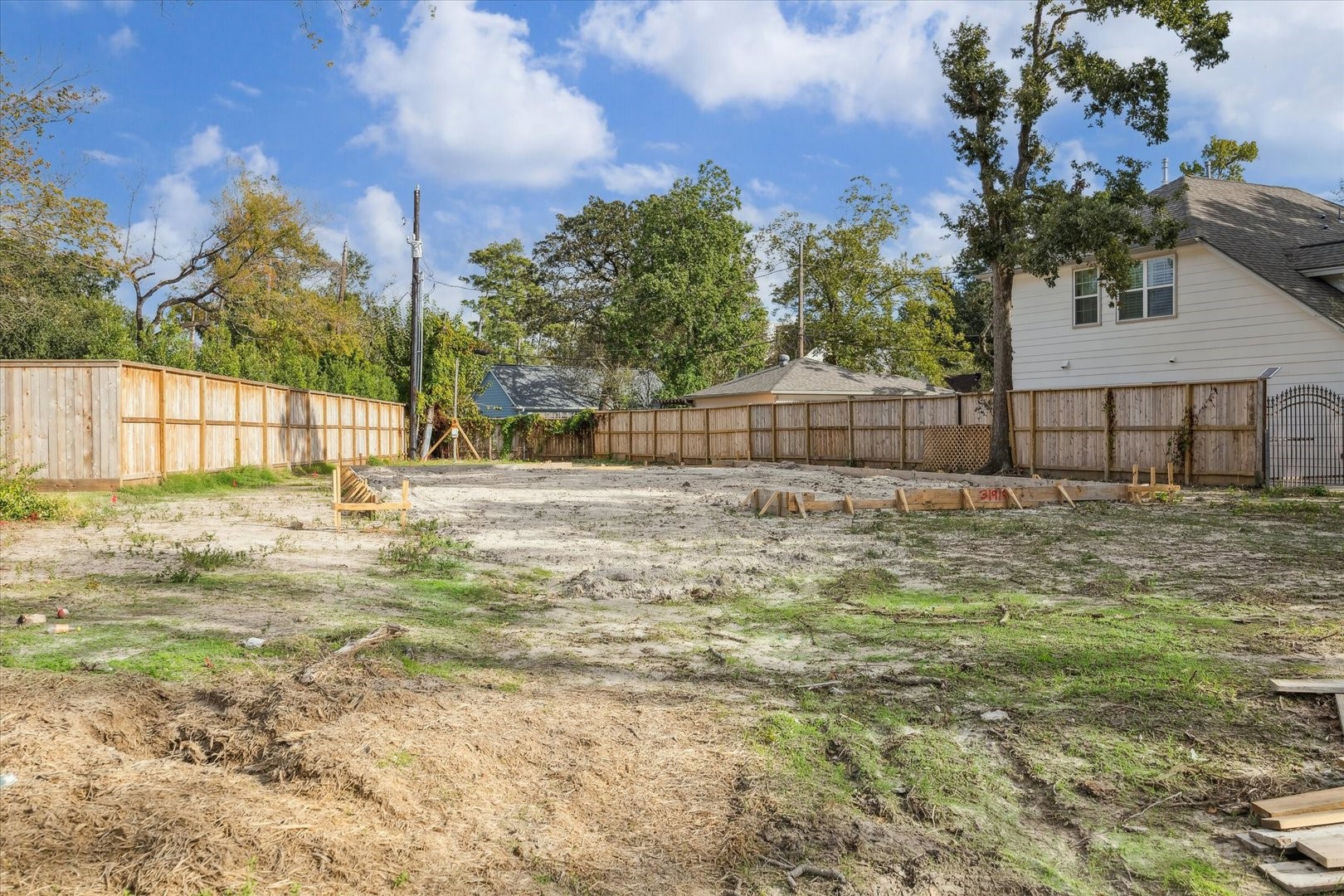 4314 Apollo Street Houston, TX 77018 - Photo 3 of 11 a view of a yard with a house in the background