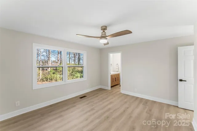 a bathroom with a sink vanity and a mirror