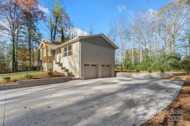 a house that has a tree in front of it