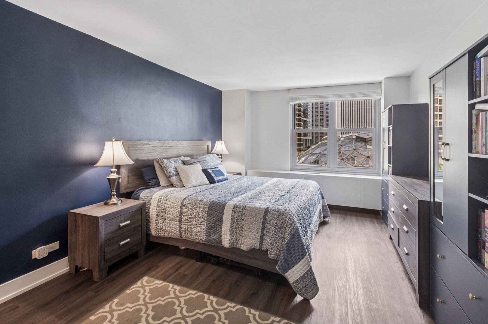 400 East Randolph Street, Unit 930 Chicago, IL 60601 - Photo 11 of 34 a bedroom with a bed and a refrigerator