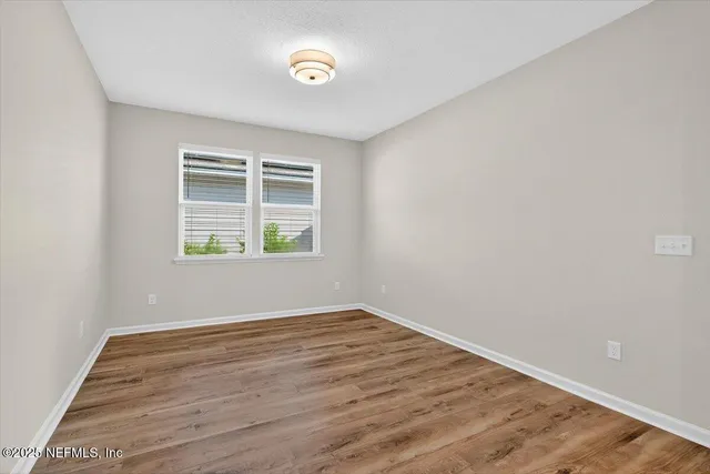 an aerial view of a residential houses with outdoor space