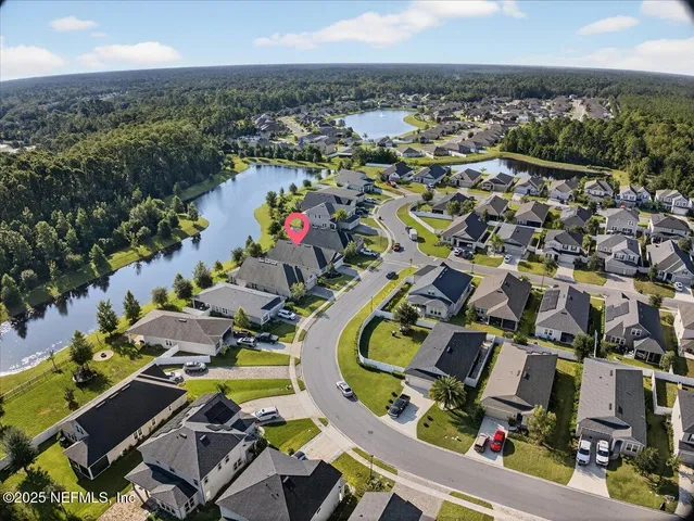 a view of room with window and wooden floor