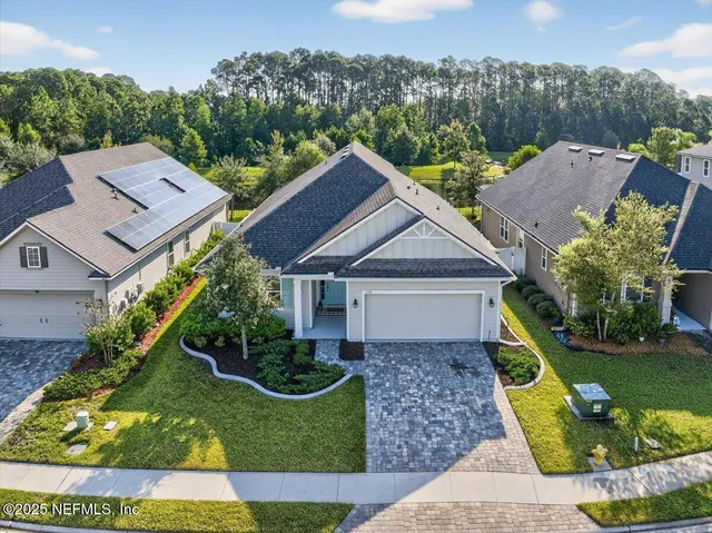 an empty room with wooden floor and window