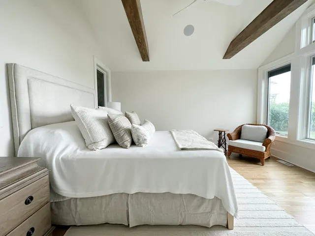 a spacious bathroom with a bathtub sink and mirror