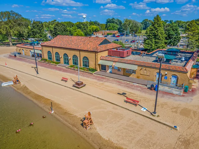 a view of a white house with a yard