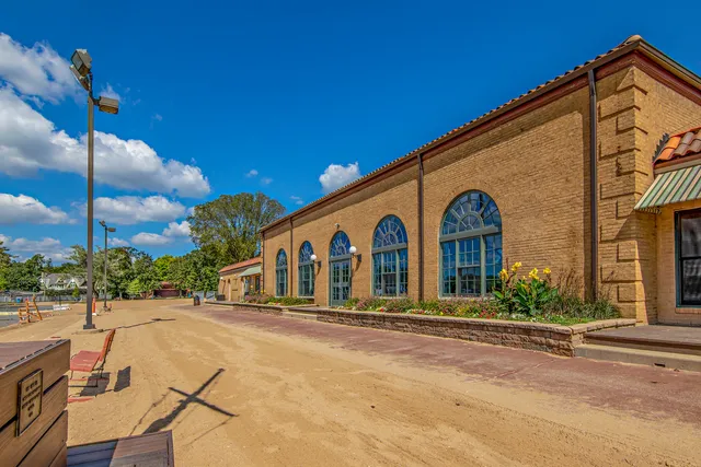 a group of people sitting in front of a building