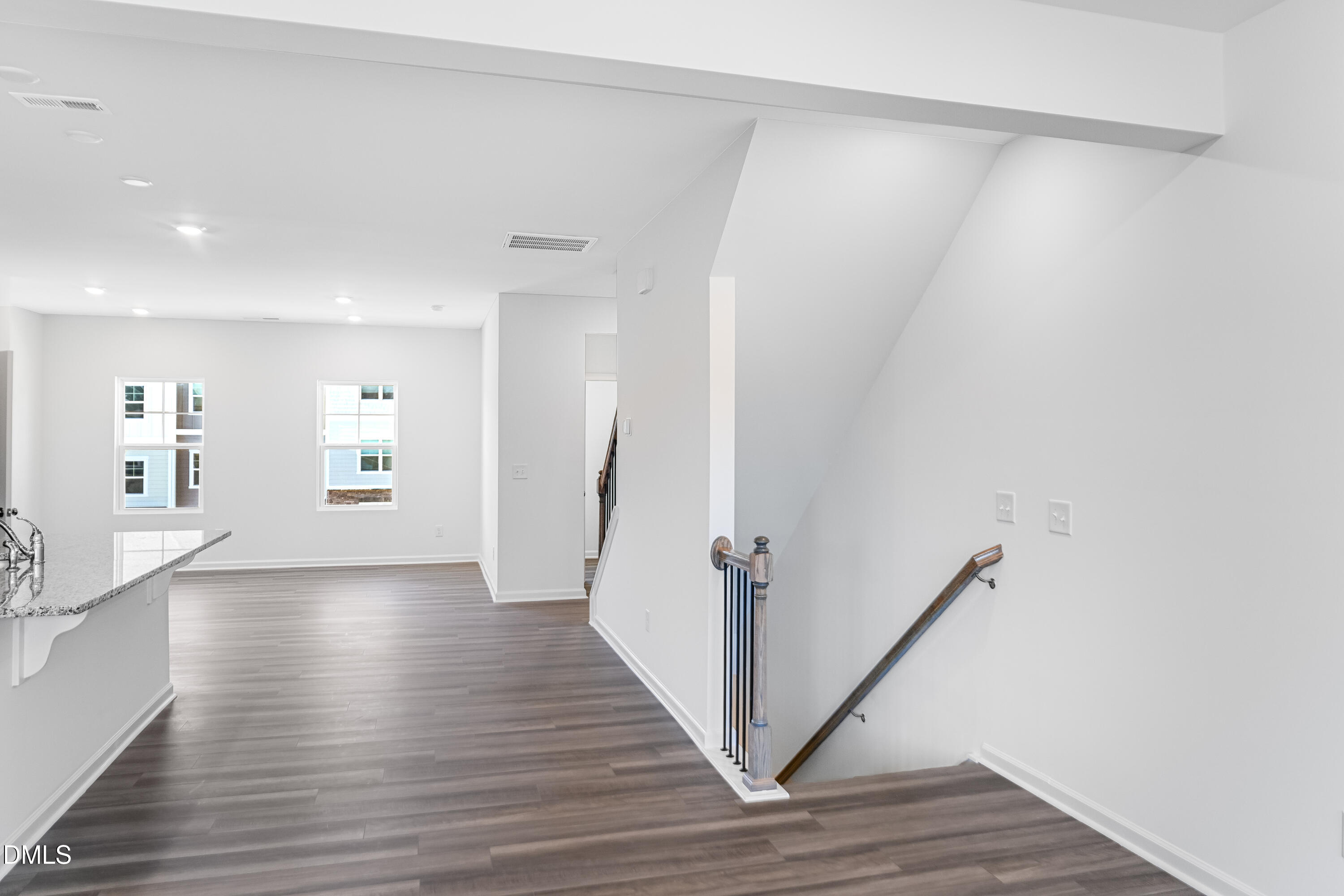 1441 Jay Road Knightdale, NC 27545 - Photo 13 of 57 a view of a hallway with wooden floor and stairs