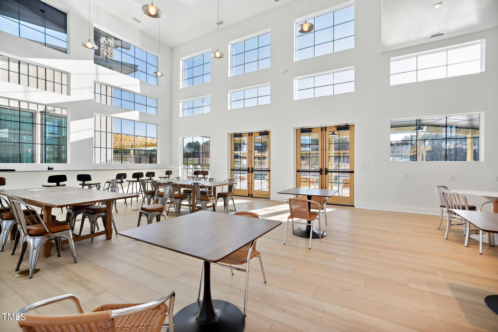 1441 Jay Road Knightdale, NC 27545 - Photo 50 of 57 a living room with furniture a table and large windows