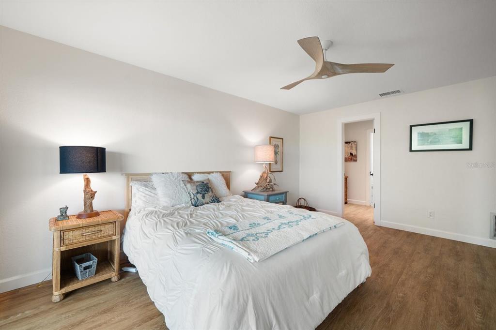 2505 Bay Boulevard, Unit 4 Indian Rocks Beach, FL 33785 - Photo 16 of 63 a bedroom with a bed and a lamp