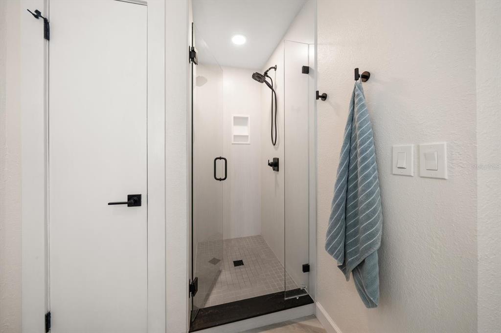 2505 Bay Boulevard, Unit 4 Indian Rocks Beach, FL 33785 - Photo 22 of 63 a bathroom with a shower