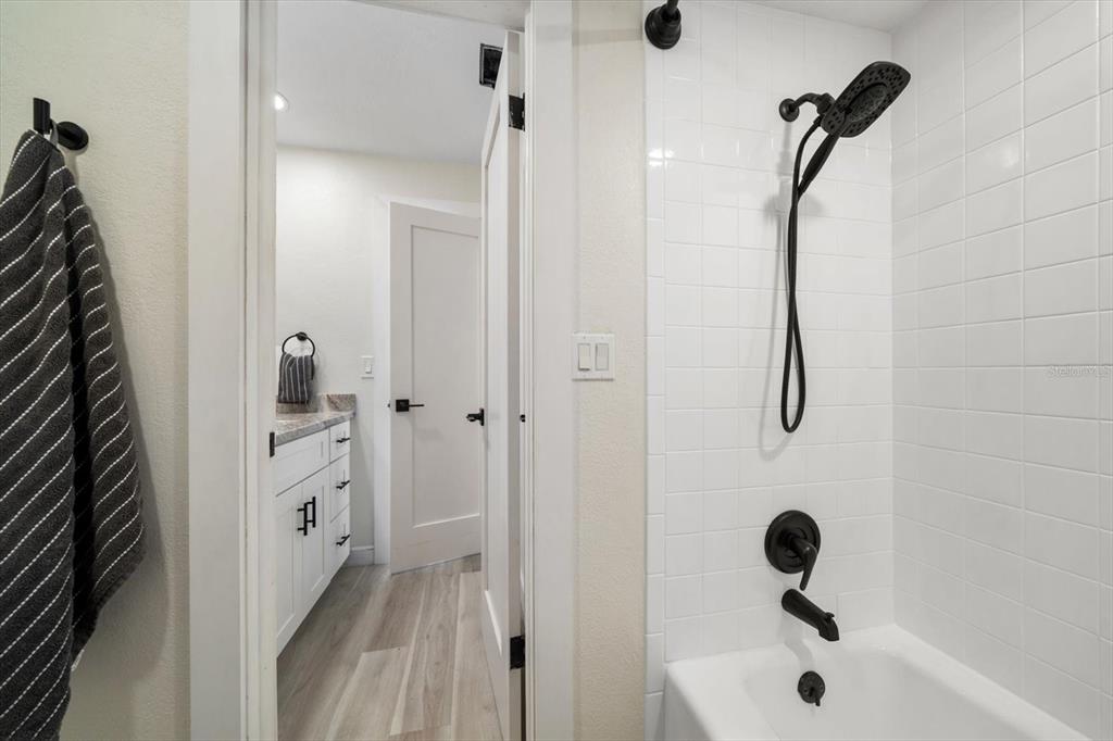 2505 Bay Boulevard, Unit 4 Indian Rocks Beach, FL 33785 - Photo 27 of 63 a bathroom with a bathtub and a shower