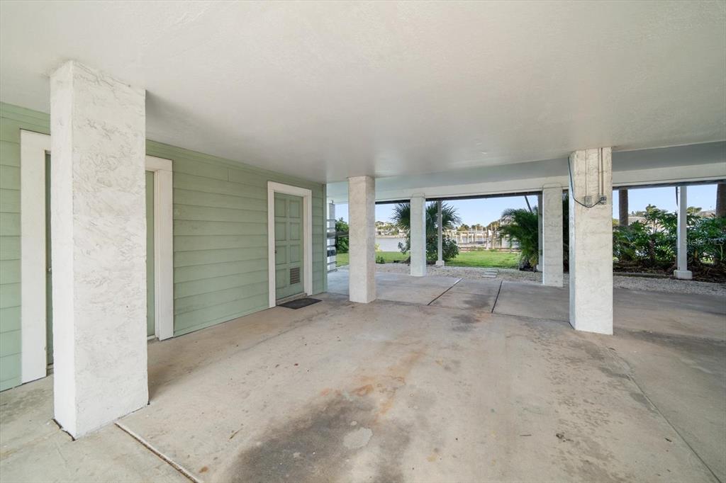 2505 Bay Boulevard, Unit 4 Indian Rocks Beach, FL 33785 - Photo 44 of 63 a view of a house with porch and garden