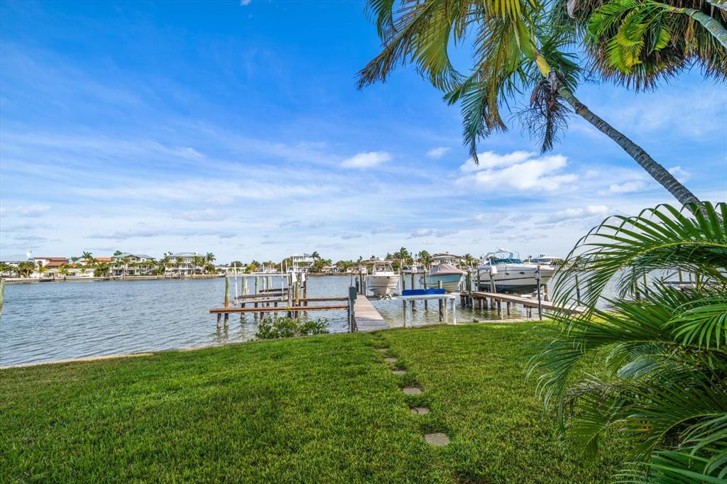 2505 Bay Boulevard, Unit 4 Indian Rocks Beach, FL 33785 - Photo 46 of 63 a view of a yard with a garden and trees
