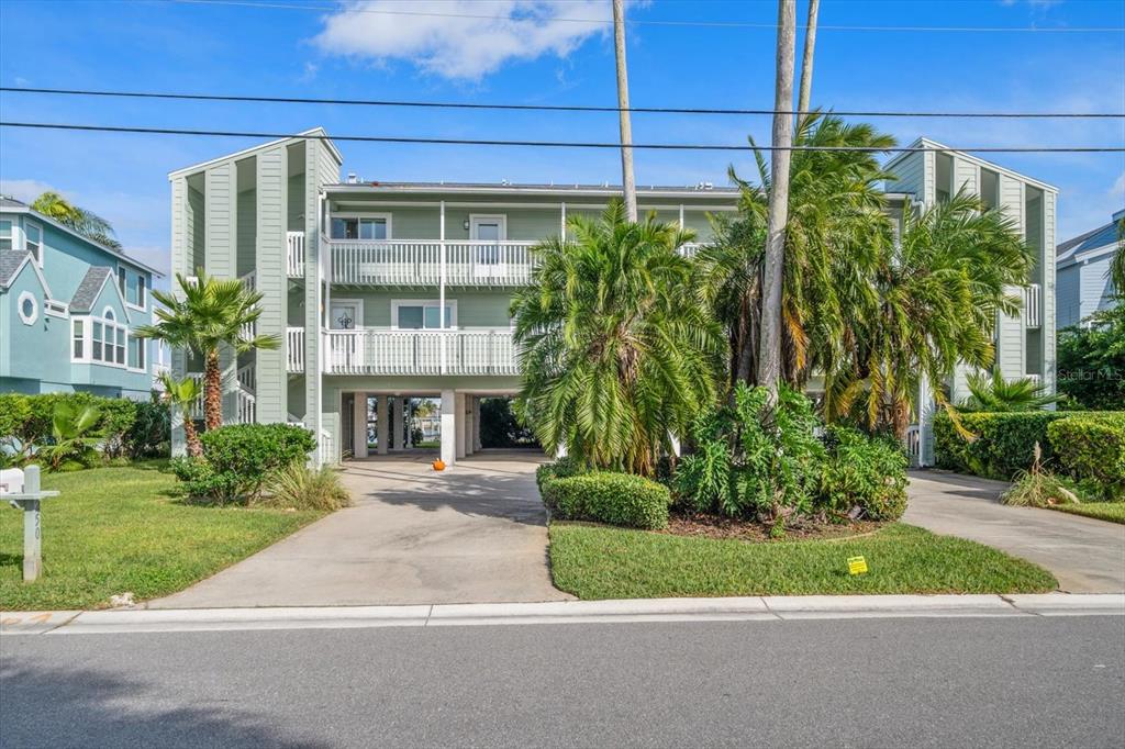 2505 Bay Boulevard, Unit 4 Indian Rocks Beach, FL 33785 - Photo 51 of 63 a front view of a house with garden