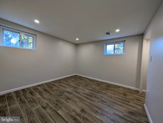a view of a livingroom with furniture and flat screen tv