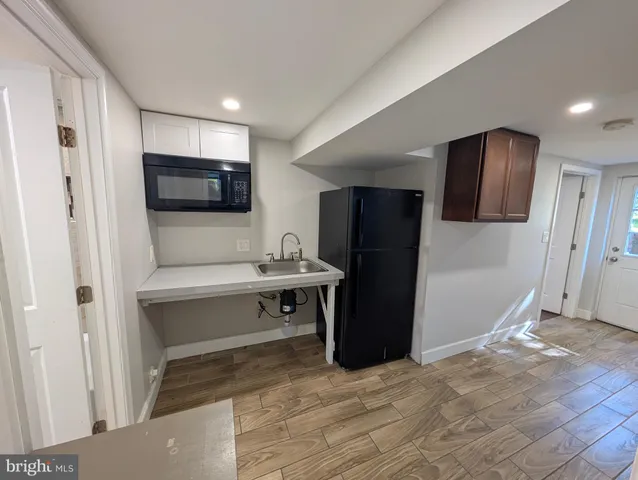 a bathroom with a toilet a sink and bathtub