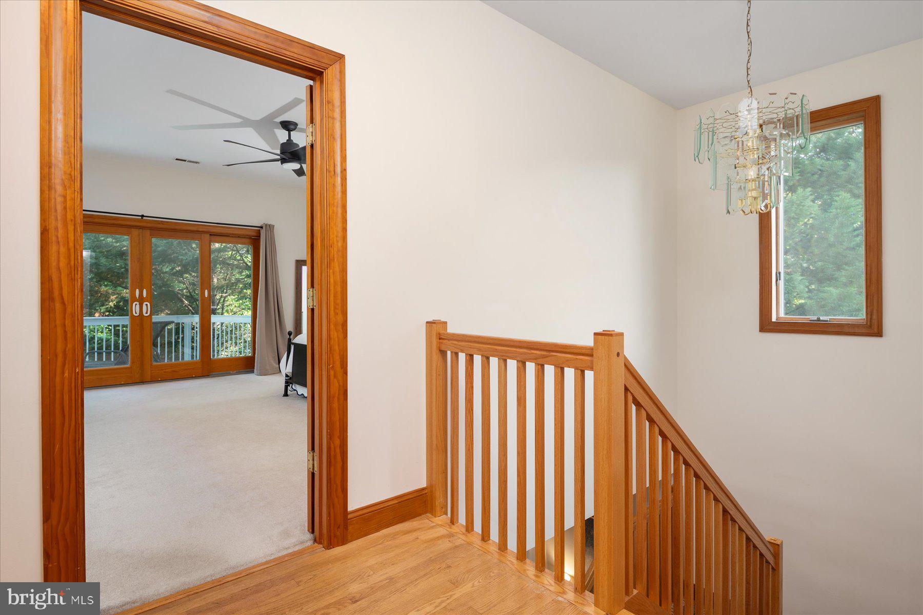 2710 Parkview Drive Riva, MD 21140 - Photo 29 of 60 a view of a hallway with wooden floor and stairs