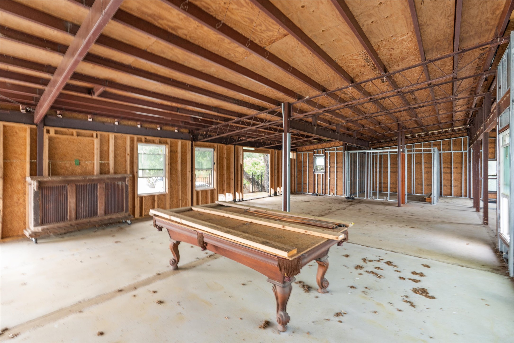 325 Eagle Rest Burnet, TX 78611 - Photo 36 of 40 A spacious, unfinished interior with exposed framing offers a blank canvas for customization.