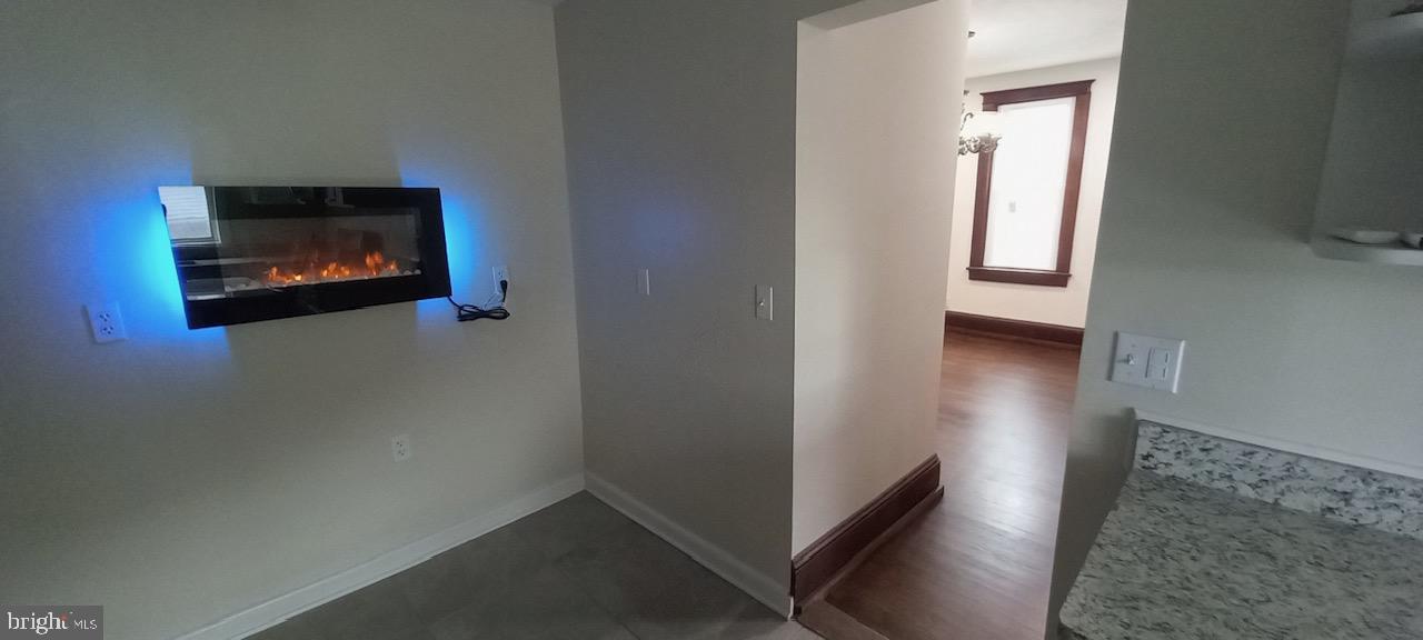 114 D Street Keyser, WV 26726 - Photo 23 of 37 a view of an empty room with wooden floor and a window