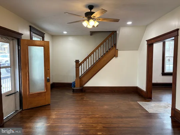 a view of an entryway with wooden floor and a window