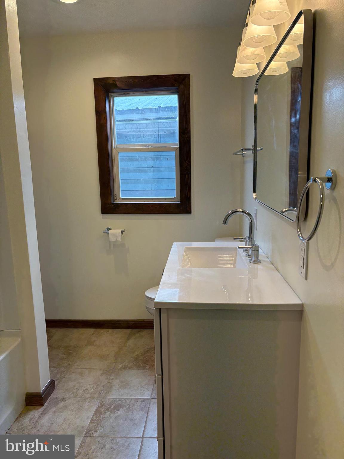 114 D Street Keyser, WV 26726 - Photo 34 of 37 a bathroom with a sink and a mirror