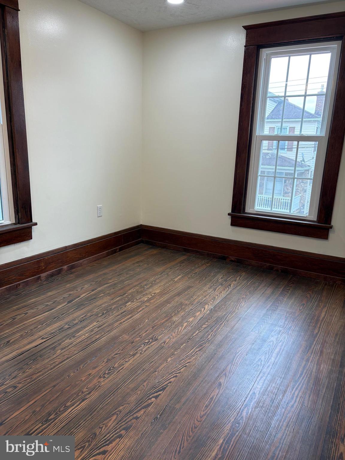 114 D Street Keyser, WV 26726 - Photo 5 of 37 a view of an empty room with wooden floor and a window