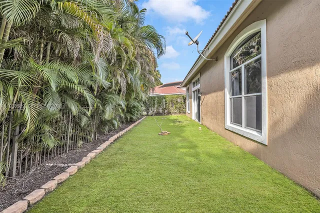 a view of swimming pool with a yard