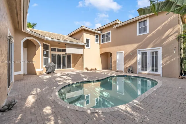 a view of a house with swimming pool