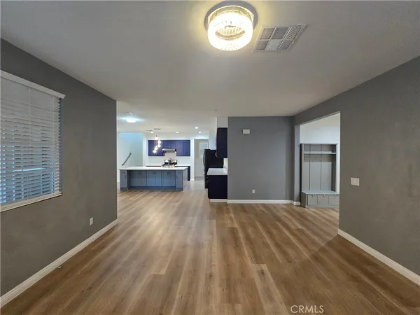 a view of a kitchen with a dishwasher cabinets and a wooden floor