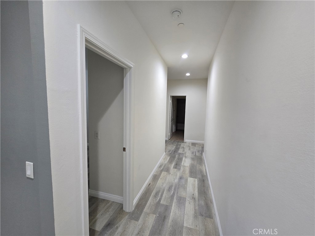 220 West Via Rua Flores Ontario, CA 91762 - Photo 24 of 51 a view of a hallway with wooden floor
