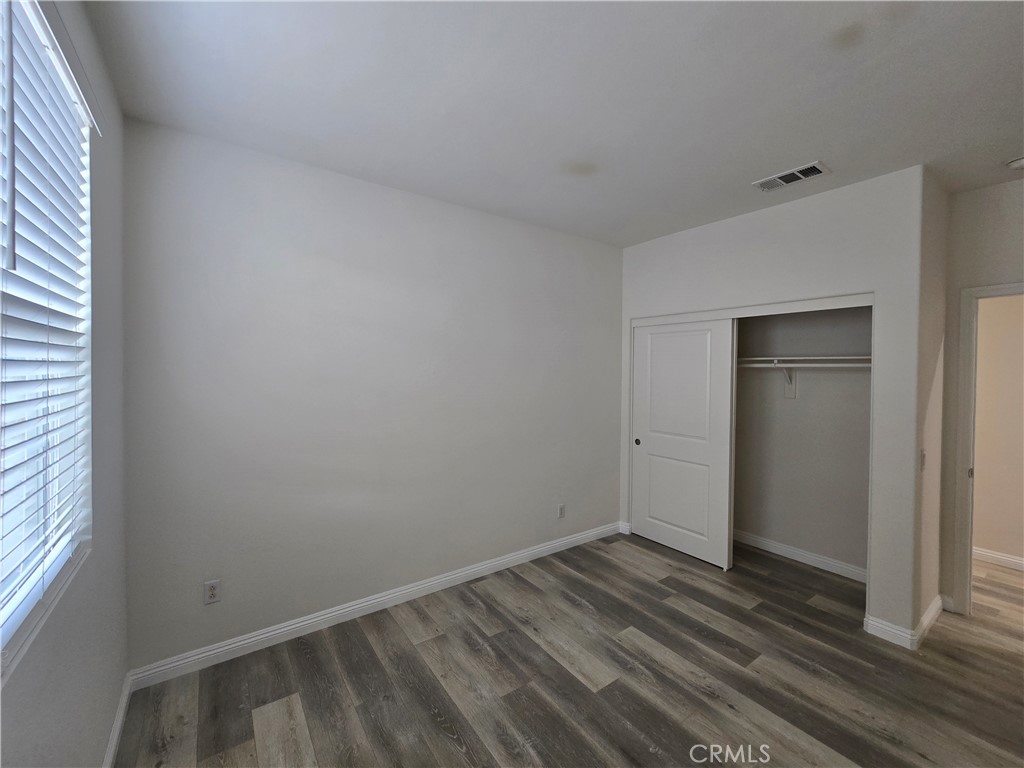 220 West Via Rua Flores Ontario, CA 91762 - Photo 26 of 51 a view of a room that has wooden floor and cabinets