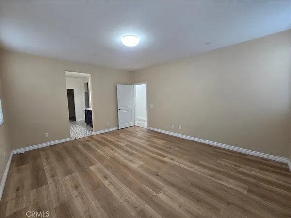 a spacious bathroom with a double vanity sink a mirror and a bathtub