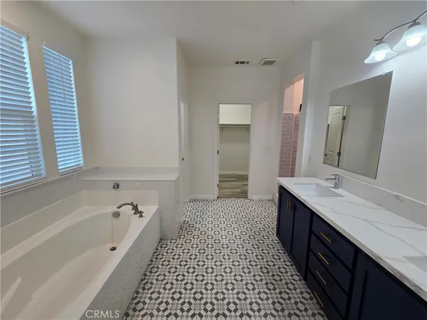 a bathroom with a toilet and a shower curtain