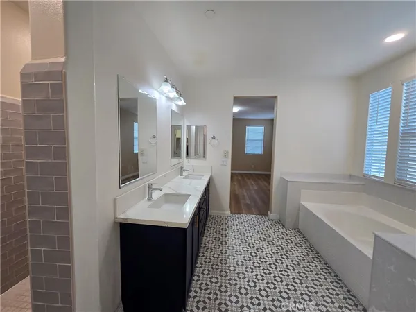 a bathroom with a bathtub and a shower