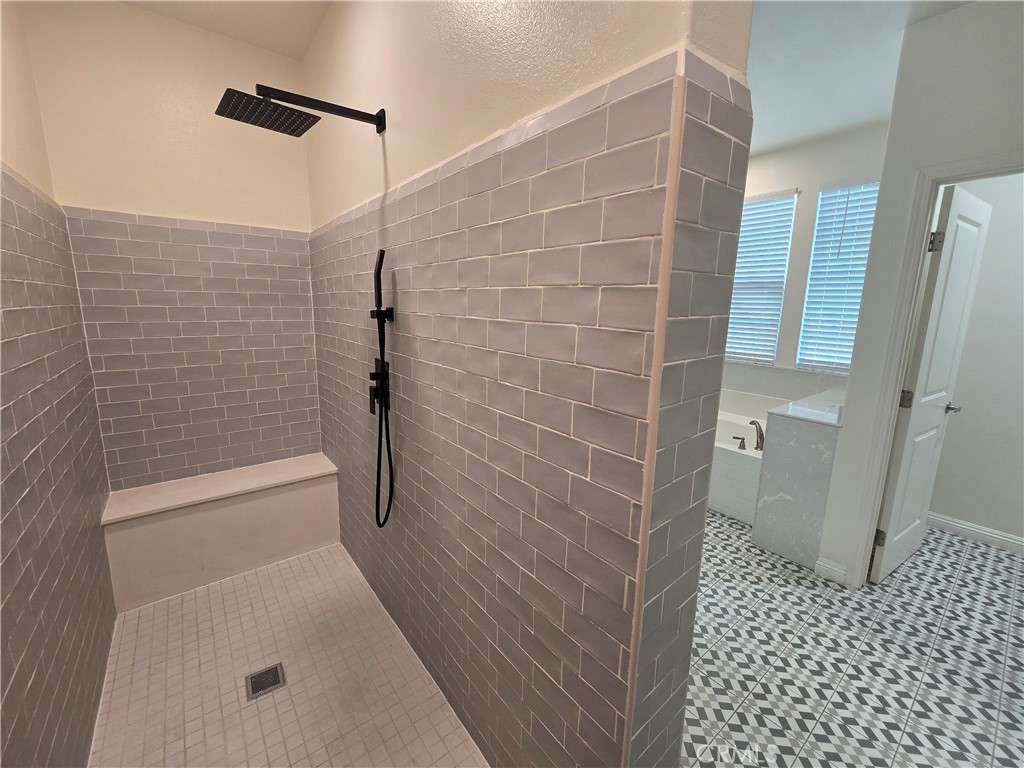 220 West Via Rua Flores Ontario, CA 91762 - Photo 37 of 51 a bathroom with a bathtub and a shower
